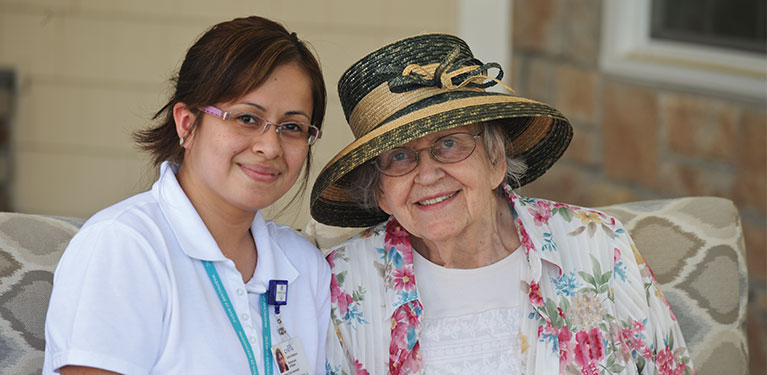 Nurse and Patient smiling looking into the camera