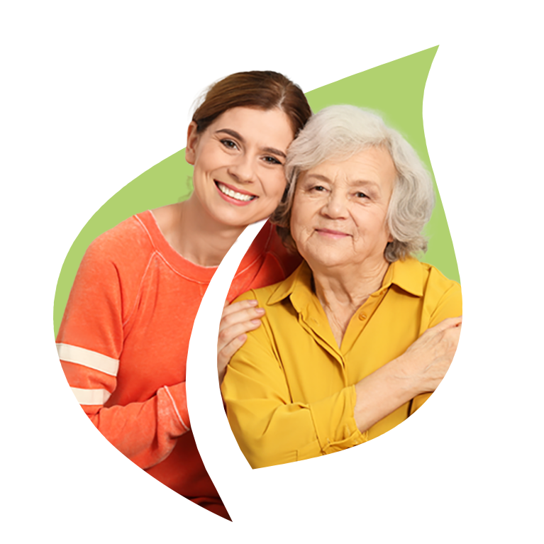 A female hospice care working with senior woman in an embrace over the Masonicare green leaf