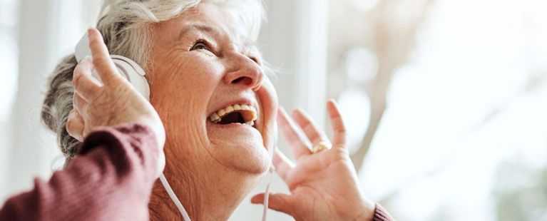 Senior woman smiling at Hearing Center