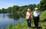 8_residents_hiking_around_pond.jpg